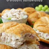 A title picture with a chicken salad sandwich cut in half and stacked up on top of each other.