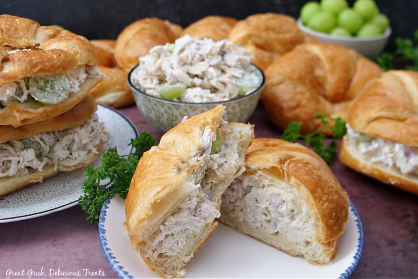 A landscape photo of croissant sandwiches filled with chicken salad.