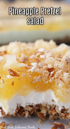 A close up of pretzel salad with pineapple.