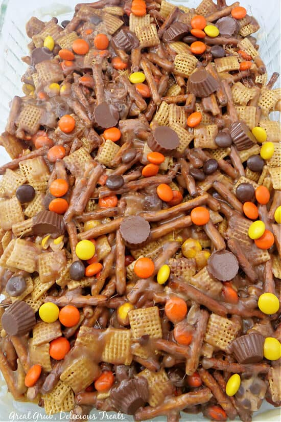 A 9x13 baking dish with uncut Chex mix bars in it.