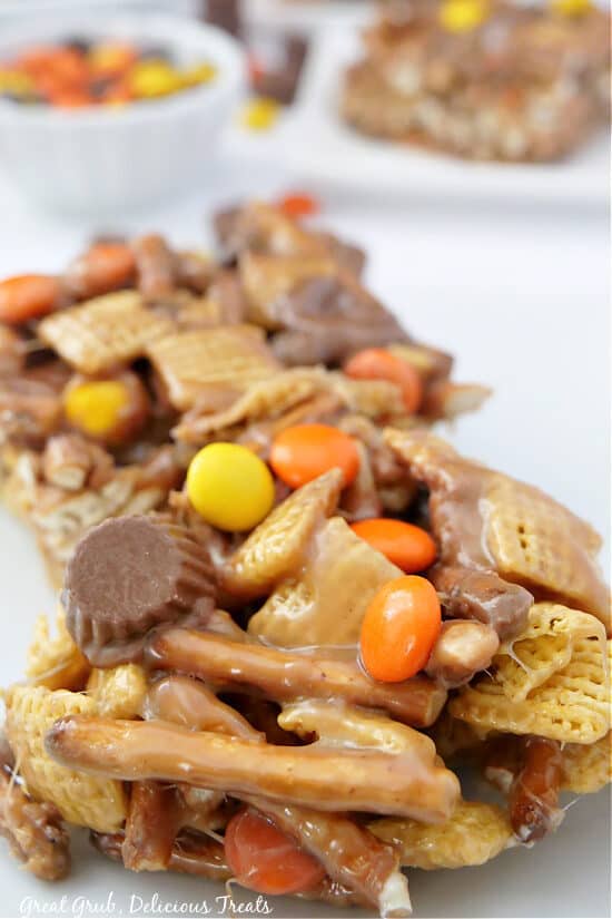 A close up of Chex mix bars with pretzels and Reese's chocolate.