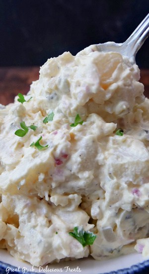 A close up of a serving of potato salad.
