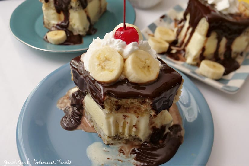 Three small plates, each with a slice of banana ice cream cake.