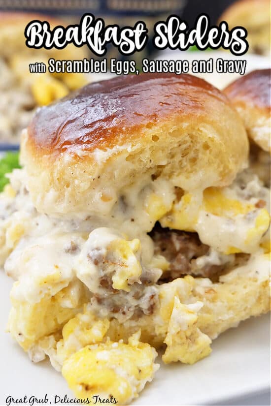 A close up of a breakfast slider with eggs, sausage, gravy and the title of the recipe at the top.