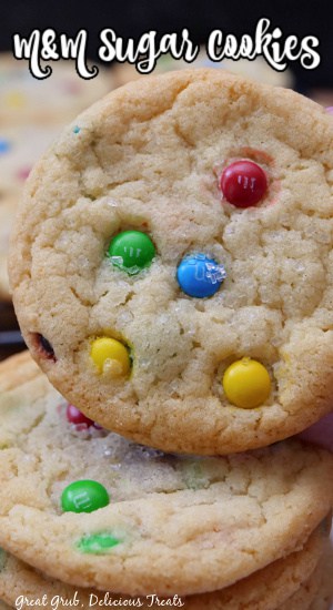 A freshly baked sugar cookie with mini M&Ms in it.