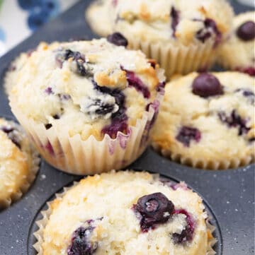 A muffin tin with freshly baked muffins in it.