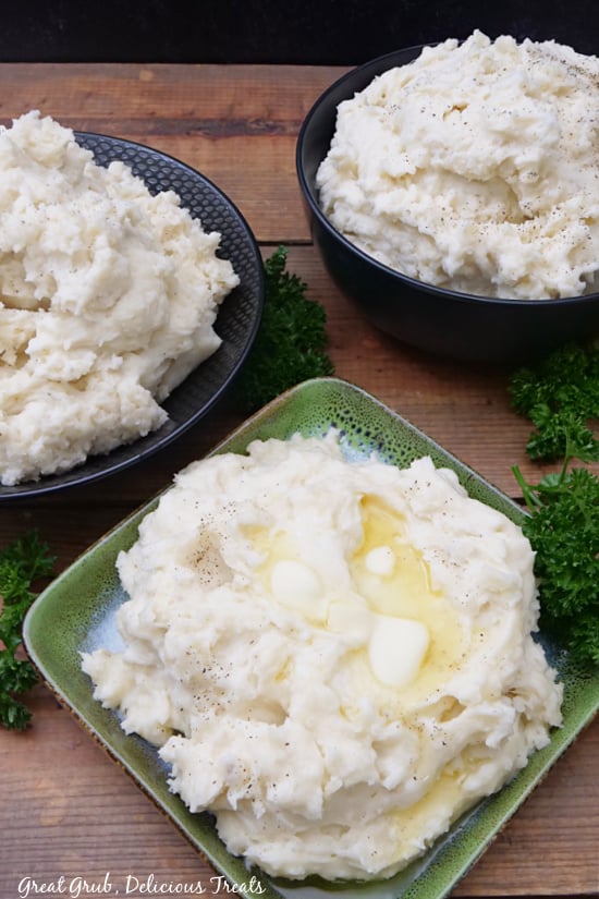 An overhead photo of three different bowls of mashed potatoes.