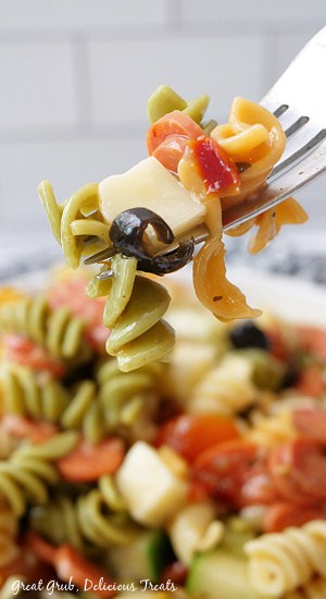 A bite of pasta salad on a fork.
