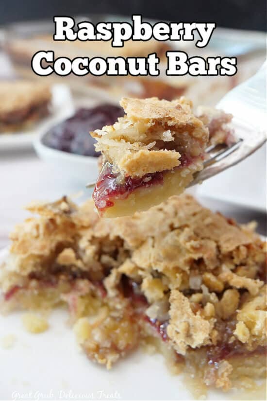 A bite of raspberry coconut bars on a fork.