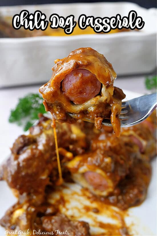 A bite of chili cheese dog on a fork.