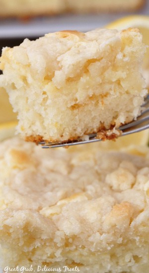 A close up of a bite of coffee cake on a fork.