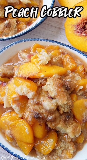An overhead photo of a white bowl with blue trim with a serving of peach cobbler in it.