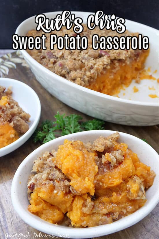 Sweet potato casserole in a white oval bowl with the white baking dish in the background.