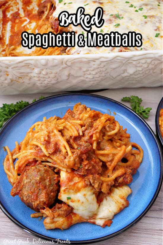 A round blue plate with a serving of spaghetti and meatballs on it.