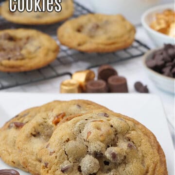 Two cookies on a white plate with a cooling rack full of cookies in the background.