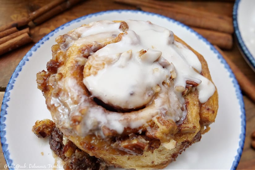 An overhead photo of a TikTok Cinnamon Roll on a white plate with blue trim.