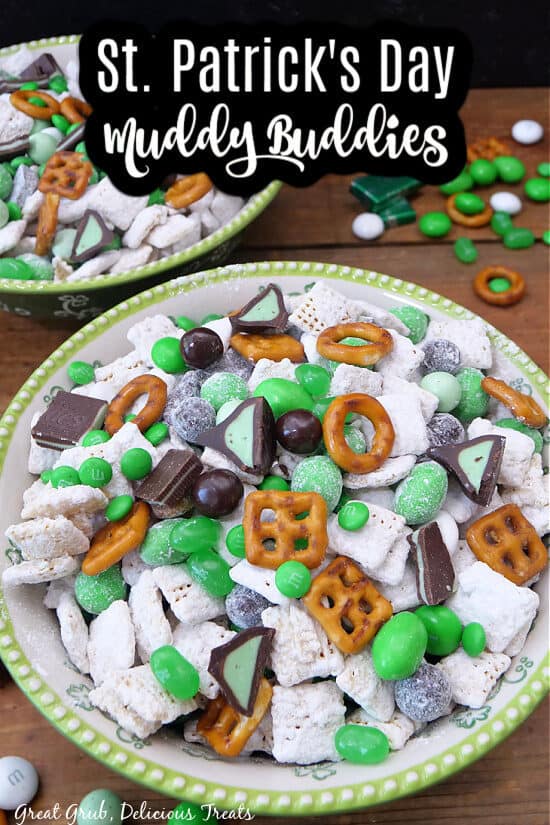 Two green and white bowls filled with St Patrick's Day Muddy Buddies.