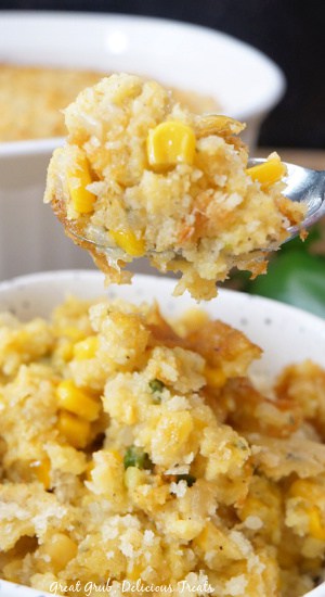 A close up of a spoonful of corn casserole.
