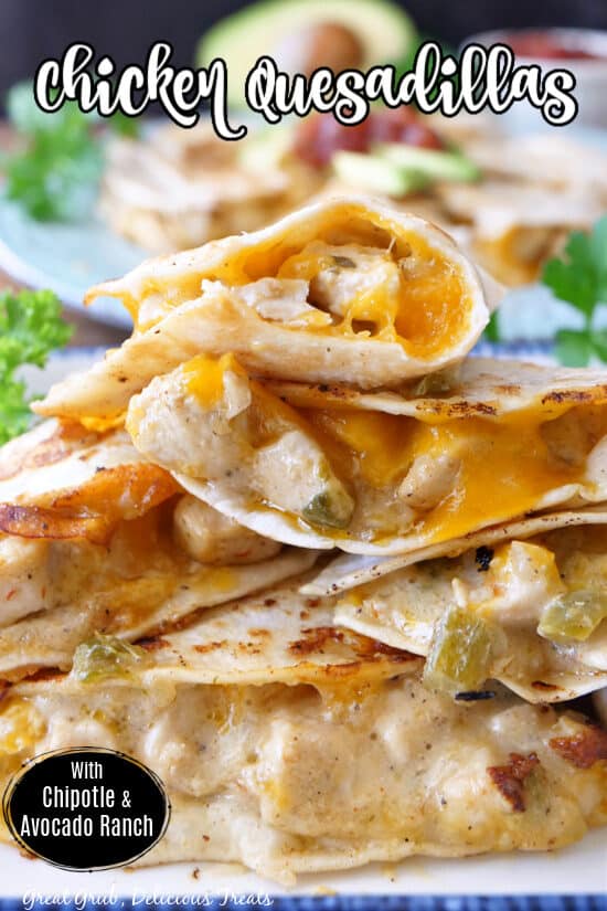 Chicken quesadillas stacked up on a white plate. 