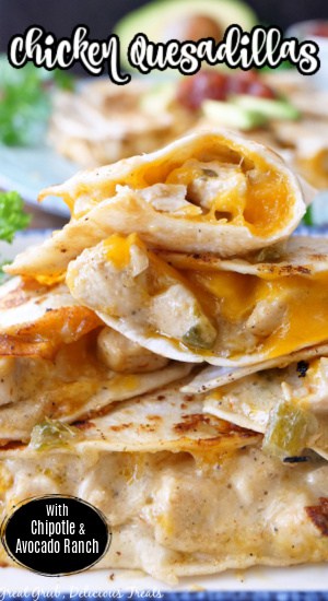 A white plate of slices of quesadillas piled up on it. 