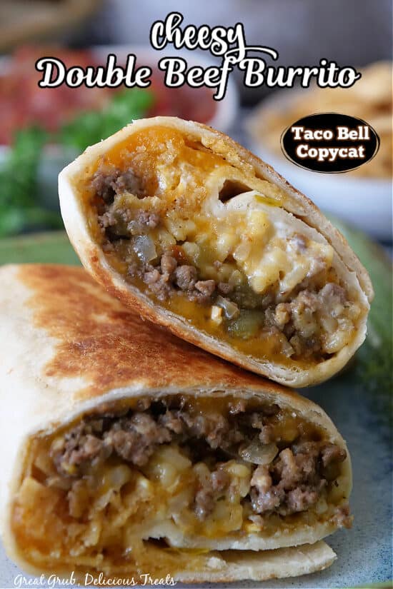 A beef burrito cut in half showing the ingredients inside.