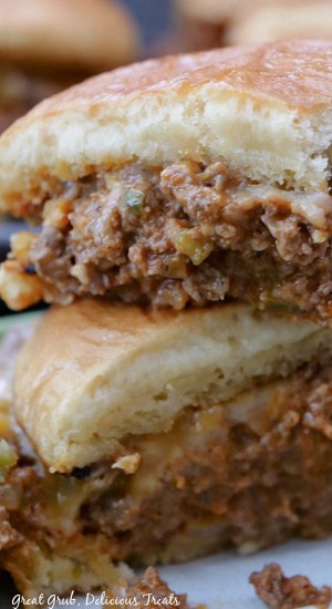 A close up of two halves of a beef sandwich.