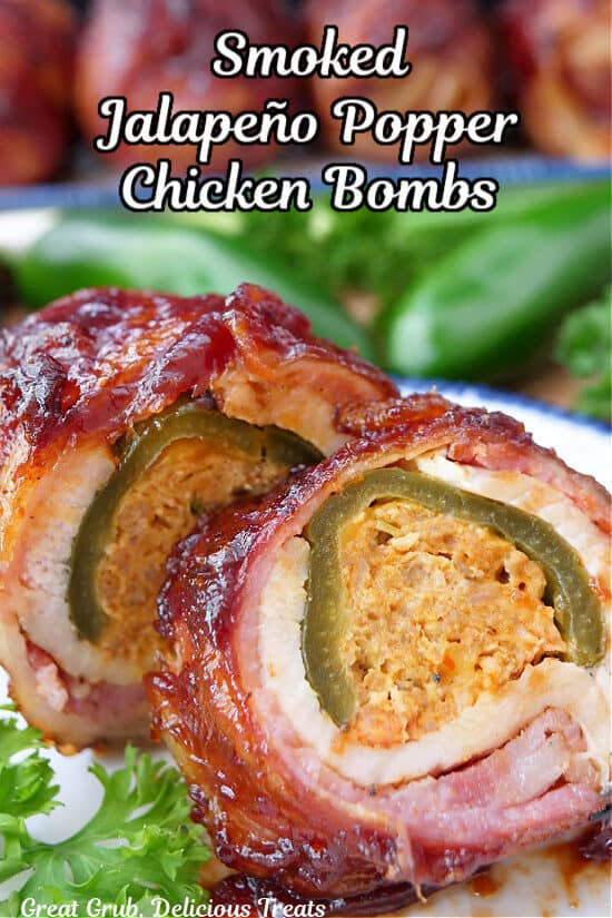 A close up of a bacon wrapped chicken breast stuffed with a jalapeno popper that has been sliced and is placed on a round white plate with blue trim.