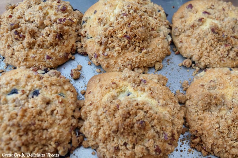 Six muffins still in the muffin pan after being removed from the oven.