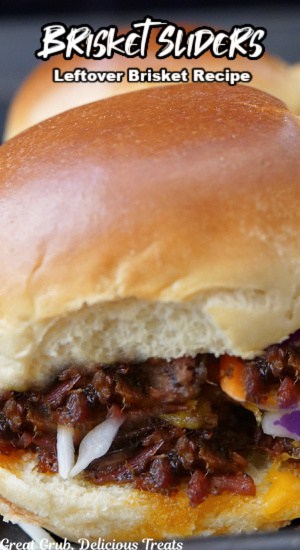 A close up of a slider bun frilled with leftover chopped smoked brisket and coleslaw.