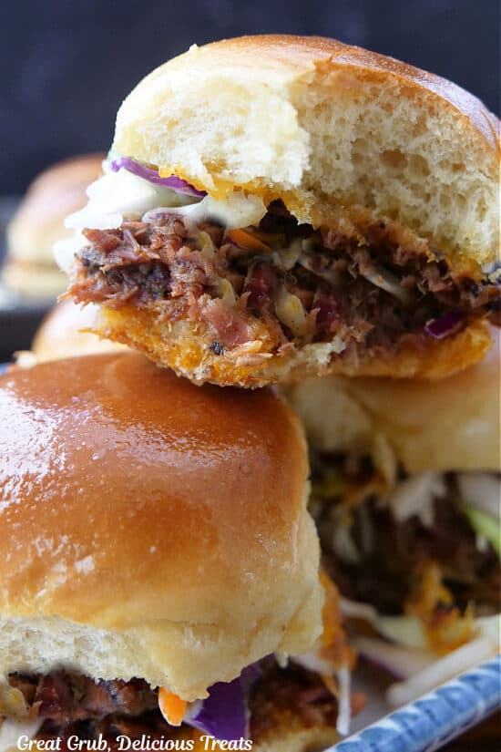 A small stack of sliders filled with leftover brisket.