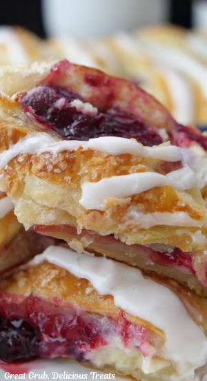 A close up of a few slices of cherry puff pastry.