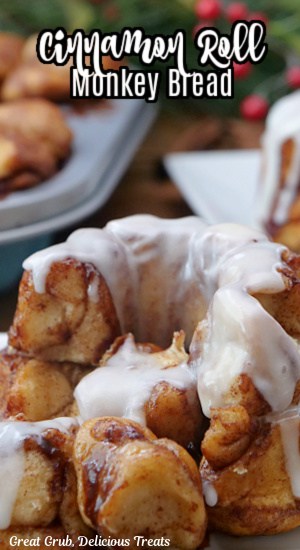 A close up of a mini monkey bread with icing over the top.