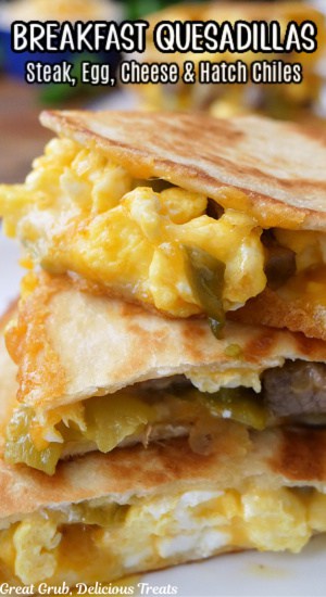 A close up of q pan fried quesadilla with eggs, steak and cheese.