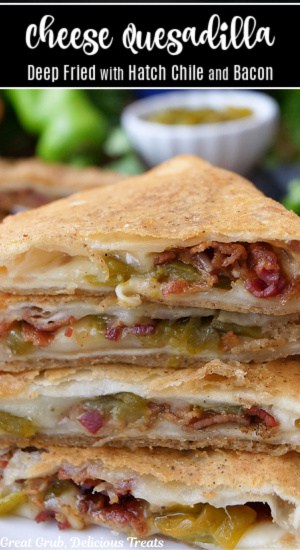 A stack of four deep fried cheese quesadillas with bacon and hatch green chiles.