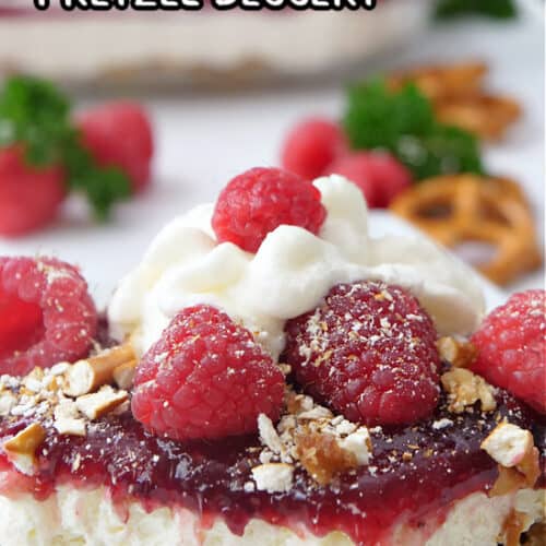 A white plate with raspberry pretzel dessert on it.