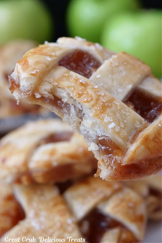 A close up of an apple pie cookie with homemade apple pie filling inside.