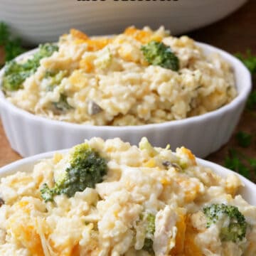 Two oval serving bowls filled with chicken broccoli rice casserole.