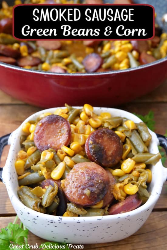 A small square serving bowl filled with a serving of sausage, green beans, and corn.