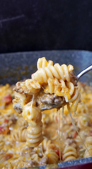 A spoonful of beef pasta.