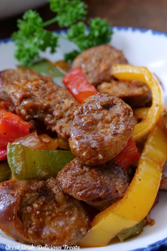 A close up of a serving of sausage and peppers.