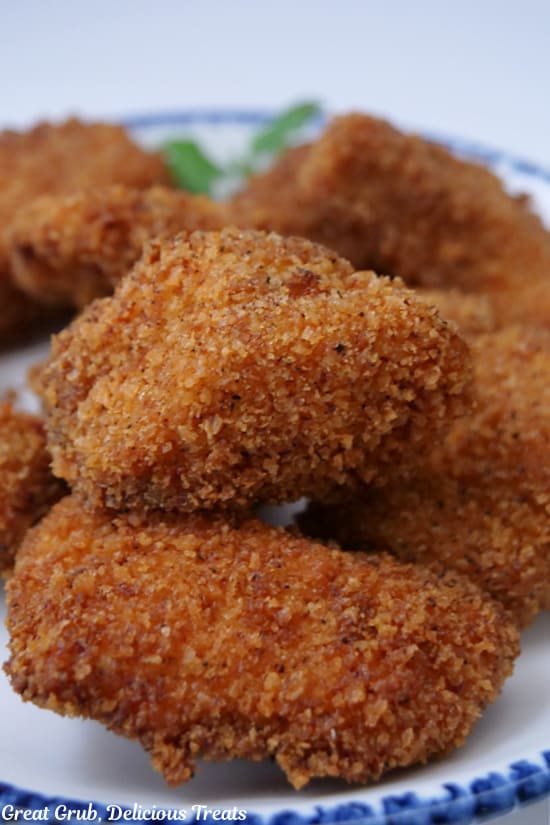 A close up photo of deep fried homemade chicken nuggets.