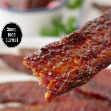 A close up of a piece of candy bacon.
