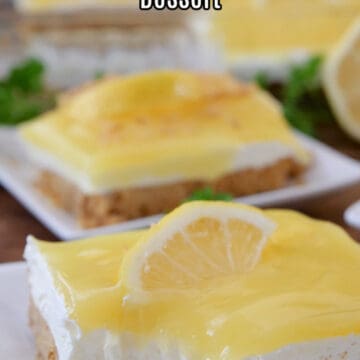 A close up of a few white plate with a slice of lemon cream cheese dessert on them.