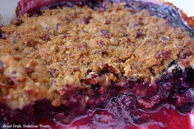 A baking dish with berry cobbler in it after it has finished baking.