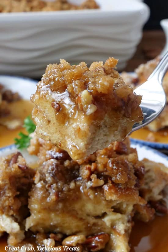 A close up of a bite of French toast bake on a fork.