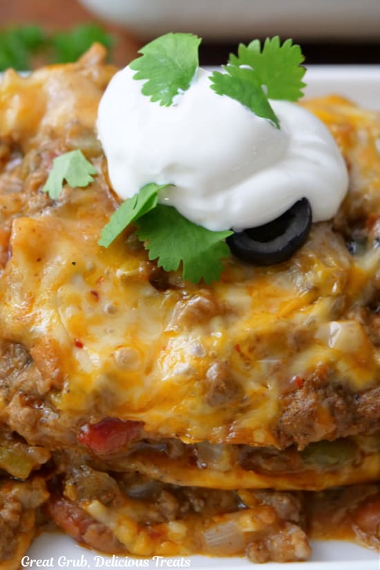 A close up of a serving of lasagna made Mexican style.
