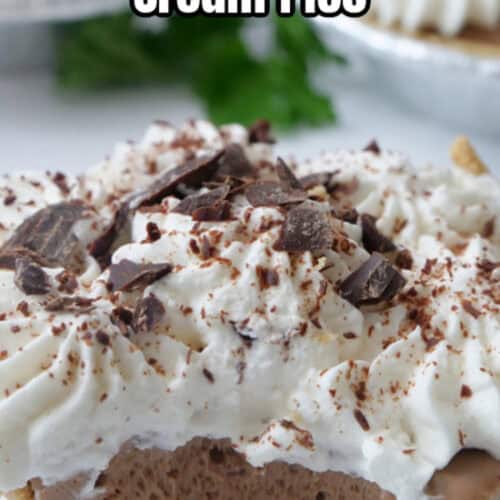 A close up of a mini chocolate pie with homemade whipped cream and chocolate shavings on top.