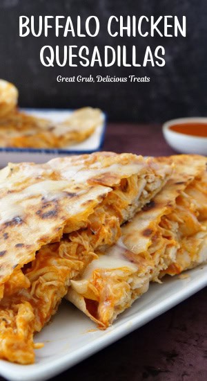 Wedge pieces of quesadillas on a white plate.
