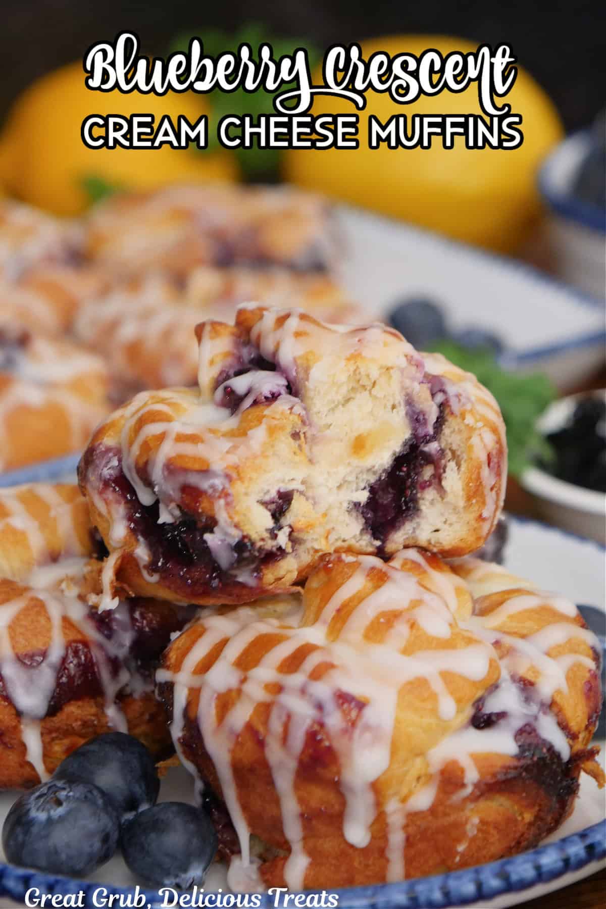 A white plate with blue trim with a small stack of blueberry crescent cream cheese muffins with a title overlay at the top.