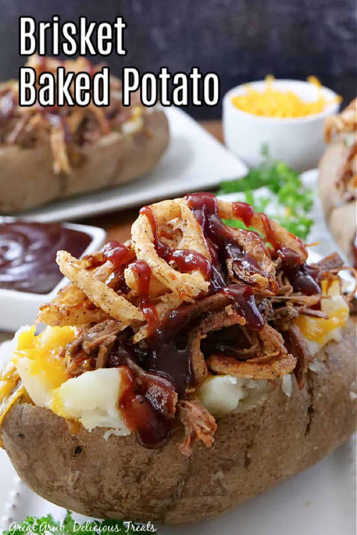 A baked potato topped with leftover brisket, cheese, fried onion strings, and barbecue sauce, with a title overlay at the top.